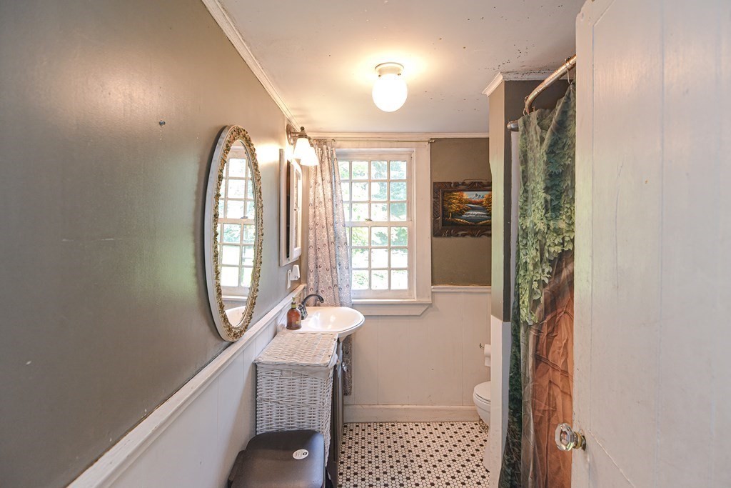 215 Burlingame Road Palmer, MA 01069 - Photo 23 of 41 a view of a hallway with wooden floor and windows
