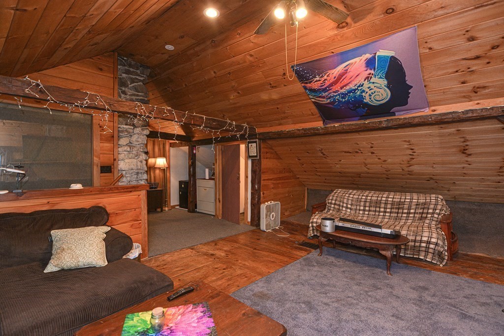 215 Burlingame Road Palmer, MA 01069 - Photo 25 of 41 a view of porch with furniture and a rug