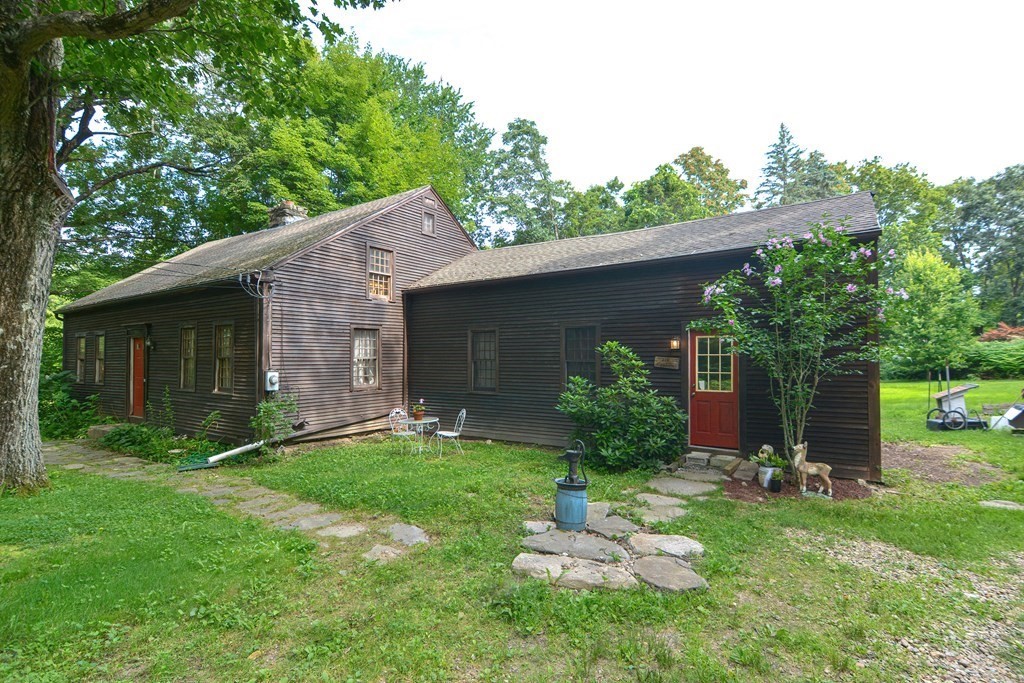 215 Burlingame Road Palmer, MA 01069 - Photo 3 of 41 a backyard of a house with table and chairs