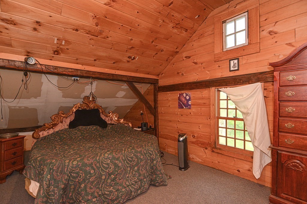 215 Burlingame Road Palmer, MA 01069 - Photo 33 of 41 a bed sitting in a bedroom next to a window