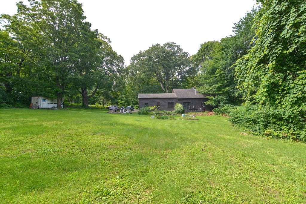 215 Burlingame Road Palmer, MA 01069 - Photo 39 of 41 a view of a house with a yard