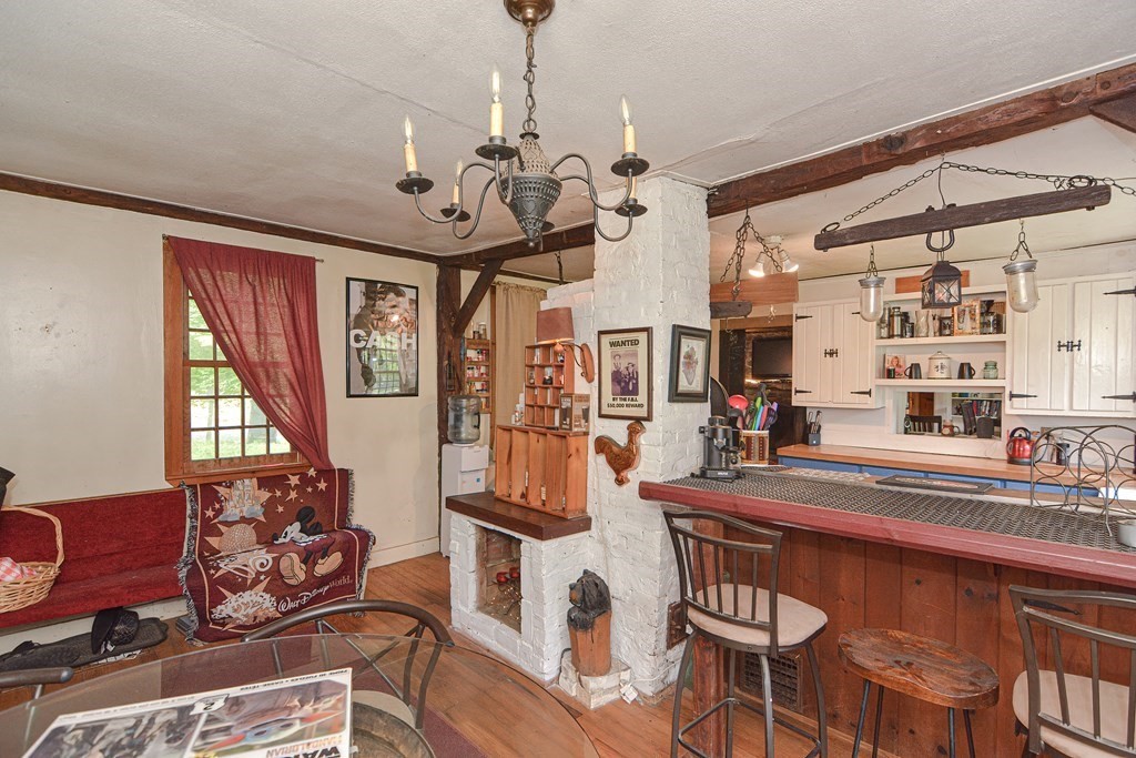 215 Burlingame Road Palmer, MA 01069 - Photo 6 of 41 a view of a dining room with furniture and a chandelier