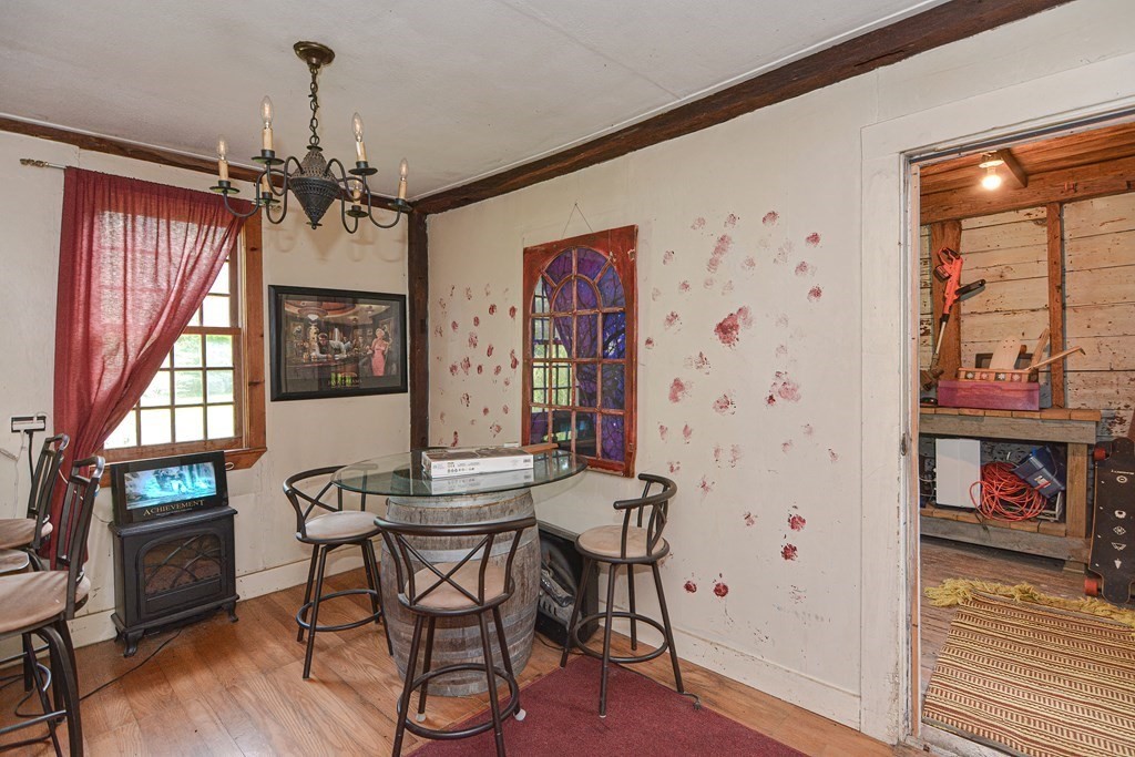 215 Burlingame Road Palmer, MA 01069 - Photo 7 of 41 a view of a dining room with furniture window and wooden floor