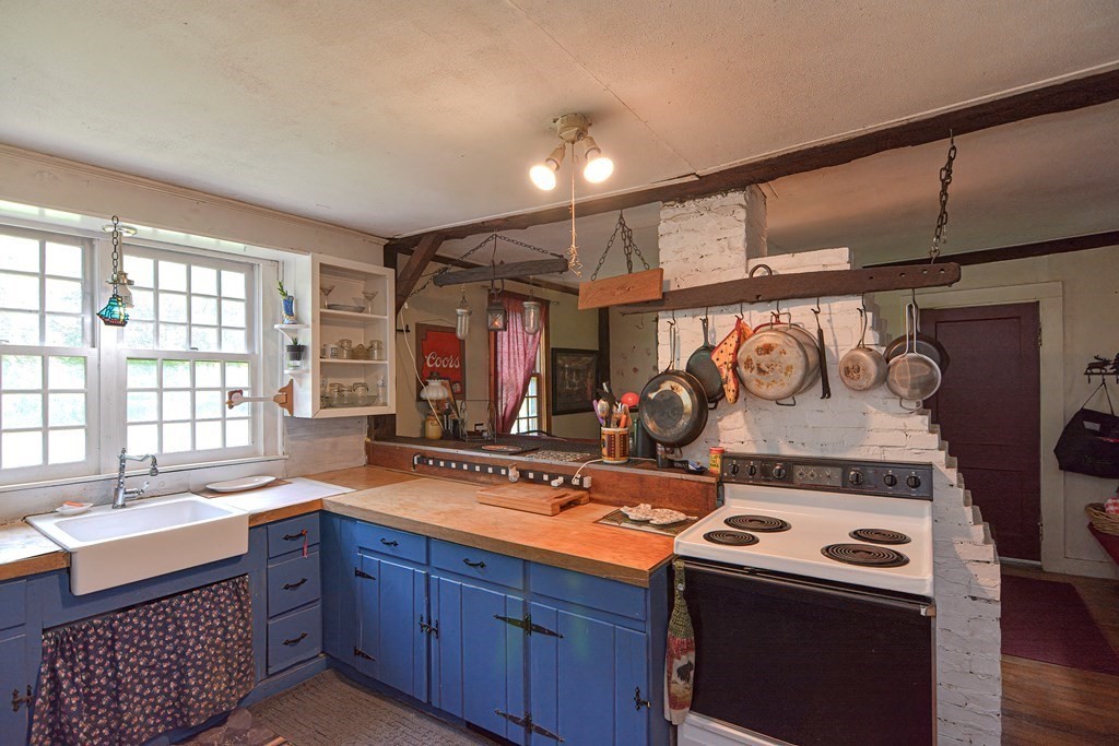 215 Burlingame Road Palmer, MA 01069 - Photo 10 of 41 a kitchen with a stove and a sink