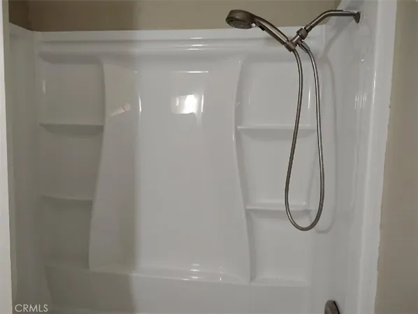 a bathroom with a glass shower door