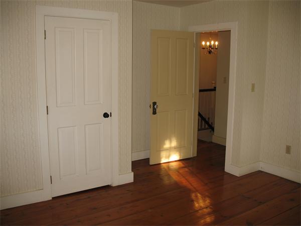 137 Hadley Road Sunderland, MA 01375 - Photo 18 of 30 a view of a hallway with wooden floor