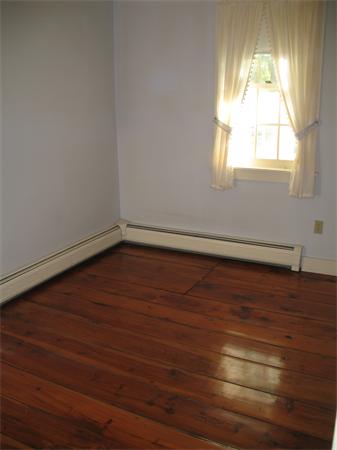 137 Hadley Road Sunderland, MA 01375 - Photo 19 of 30 an empty room with wooden floor and windows