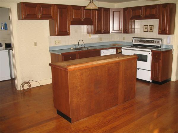 137 Hadley Road Sunderland, MA 01375 - Photo 3 of 30 a kitchen with stainless steel appliances a sink cabinets and wooden floor