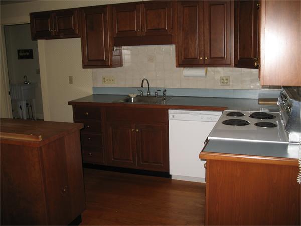 137 Hadley Road Sunderland, MA 01375 - Photo 5 of 30 a kitchen with a refrigerator and a sink