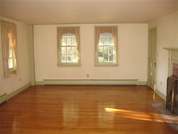 137 Hadley Road Sunderland, MA 01375 - Photo 10 of 30 a view of an empty room with wooden floor and a window