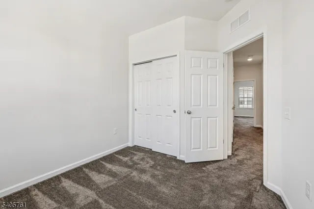 an empty room with a wooden door