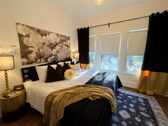 a bedroom with bed and window