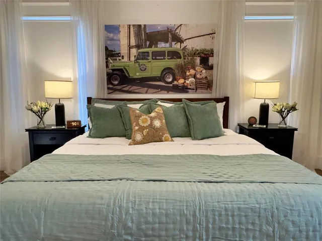 a bedroom with a bed and dresser