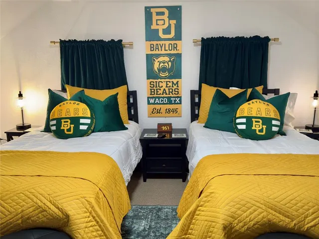 a bedroom with a bed and dresser