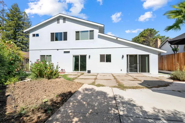 a view of backyard of a house