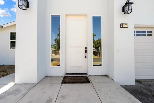a view of a entryway door front of house