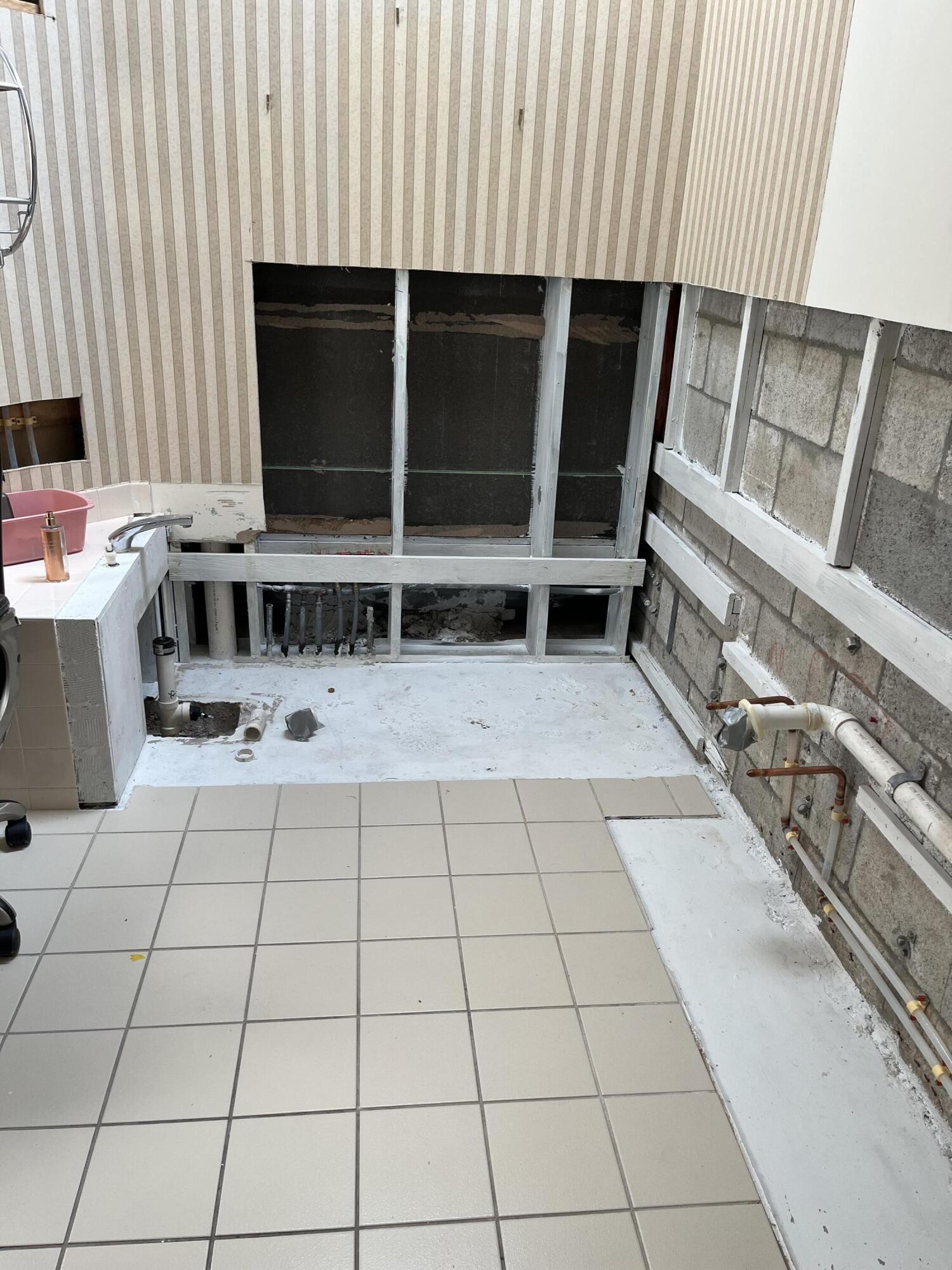 206 South Hampton Drive Jupiter, FL 33458 - Photo 11 of 24 a view of an empty room with wooden floor and a window