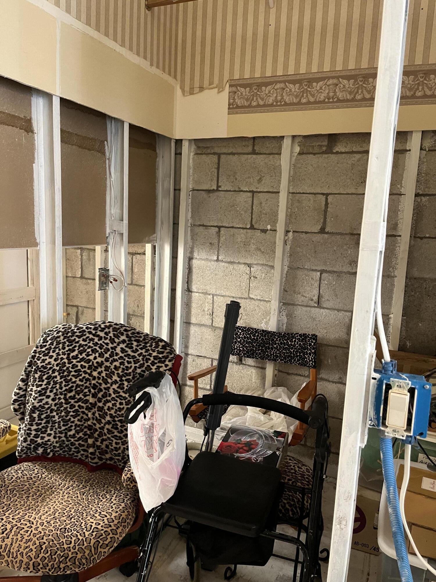 206 South Hampton Drive Jupiter, FL 33458 - Photo 8 of 24 a bedroom with furniture and a window