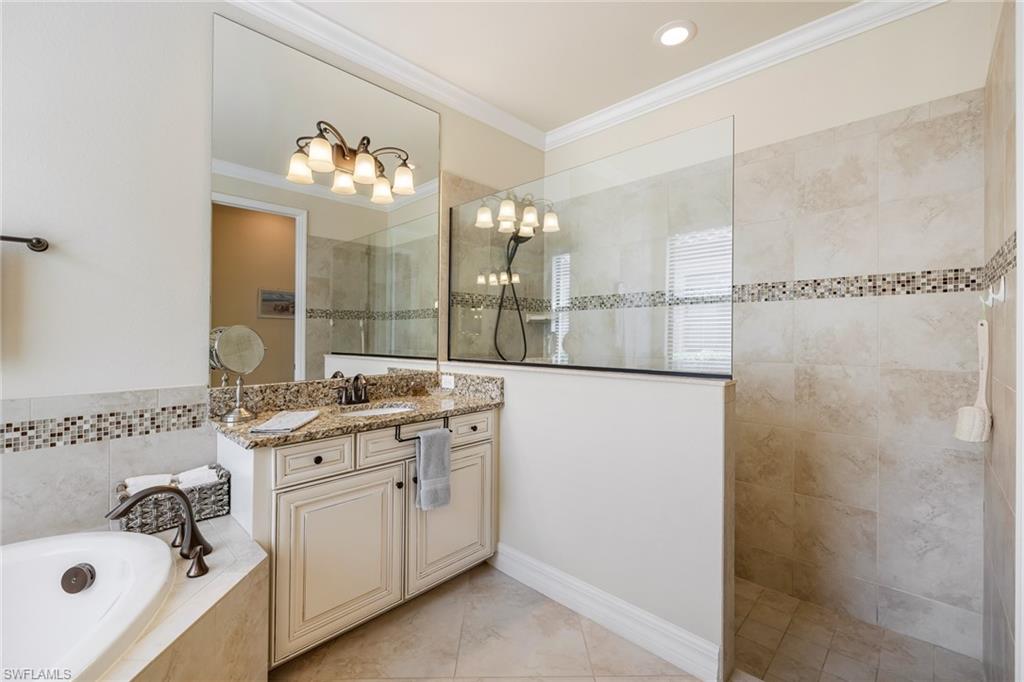 28529 Westmeath Court Bonita Springs, FL 34135 - Photo 14 of 49 a bathroom with a sink vanity and mirror