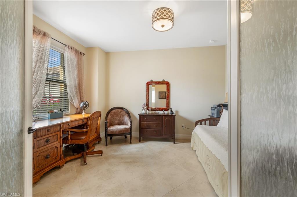 28529 Westmeath Court Bonita Springs, FL 34135 - Photo 19 of 49 a bedroom with furniture and a window