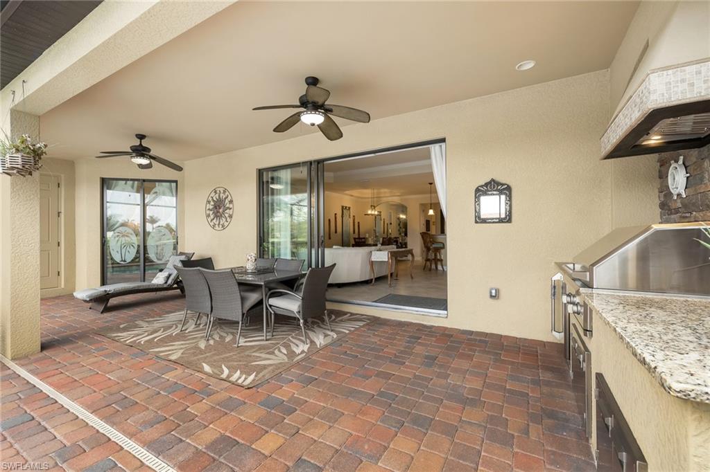 28529 Westmeath Court Bonita Springs, FL 34135 - Photo 22 of 49 a dining room with furniture and a large window