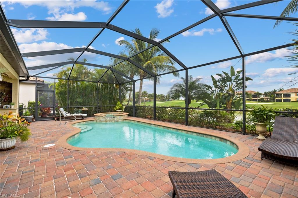 28529 Westmeath Court Bonita Springs, FL 34135 - Photo 23 of 49 a view of a swimming pool with a lounge chairs