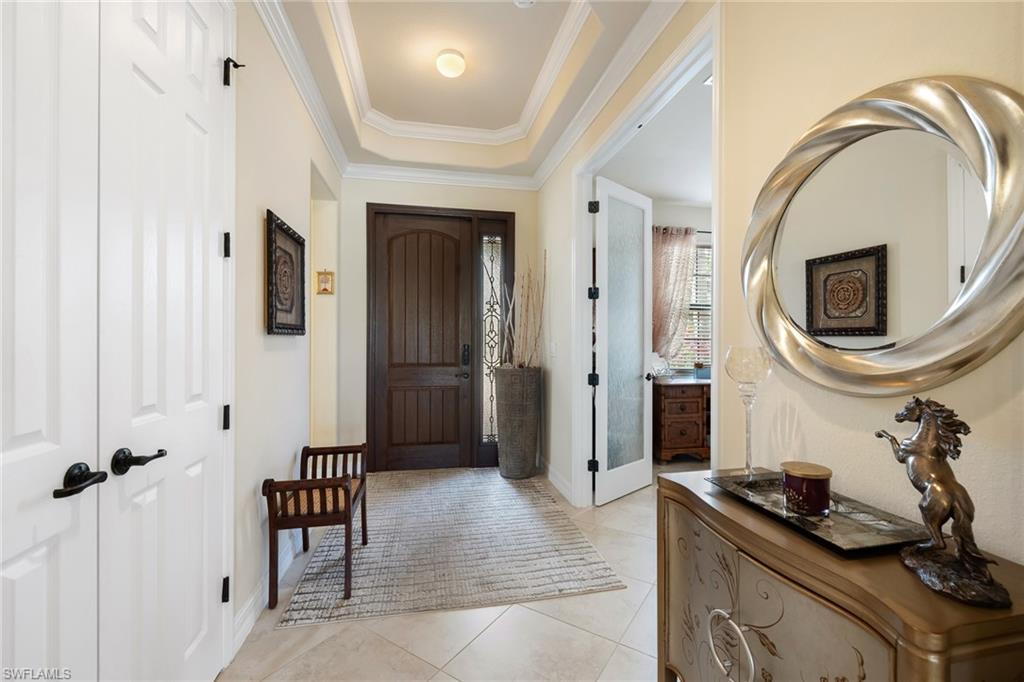 28529 Westmeath Court Bonita Springs, FL 34135 - Photo 3 of 49 a bathroom with a sink a mirror and shower