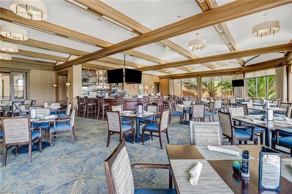 28529 Westmeath Court Bonita Springs, FL 34135 - Photo 43 of 49 a view of a dining hall with lots of tables a large dining table and chairs