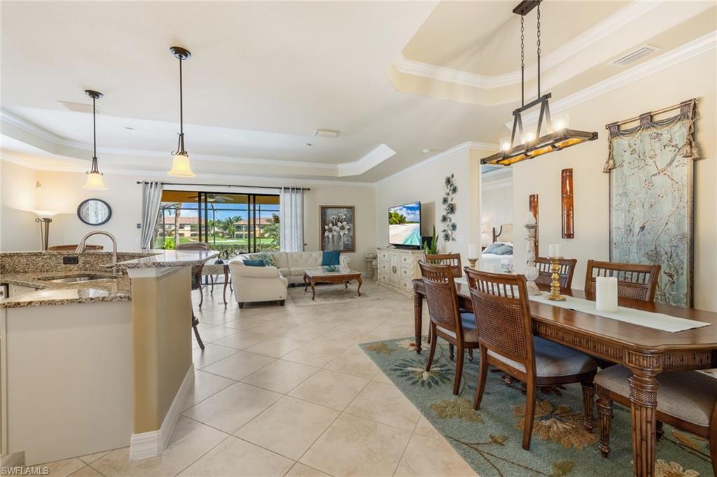 28529 Westmeath Court Bonita Springs, FL 34135 - Photo 6 of 49 a room with lots of white furniture and a wooden floor