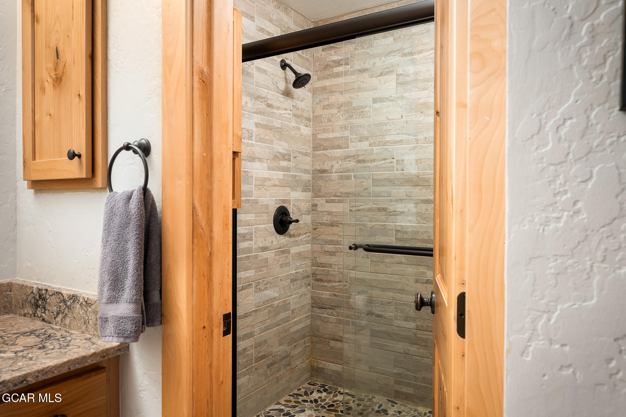 605 Lake Front Road, Unit W8 Grand Lake, CO 80447 - Photo 19 of 28 a bathroom with a shower and a sink