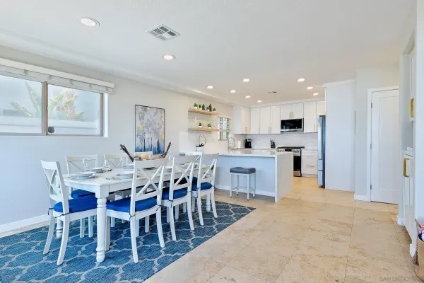 a kitchen with a sink a counter top space and appliances