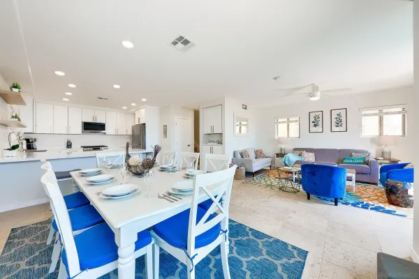a kitchen with stainless steel appliances granite countertop a refrigerator sink and stove
