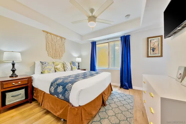 a bedroom with a bed and a lamp