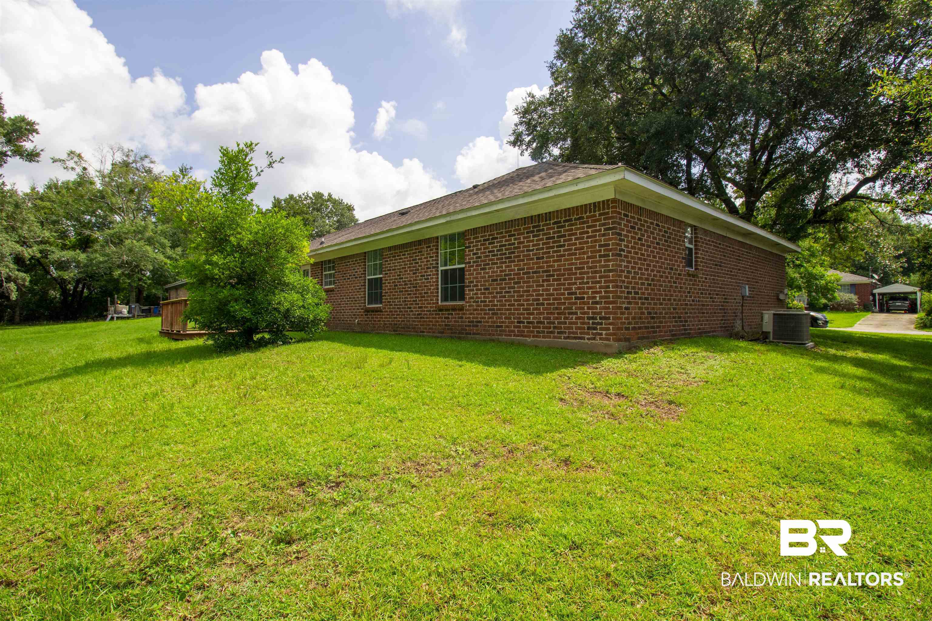 13255 Pointer Drive West Foley, AL 36535 - Photo 7 of 25 View of side of property featuring central AC unit and a lawn