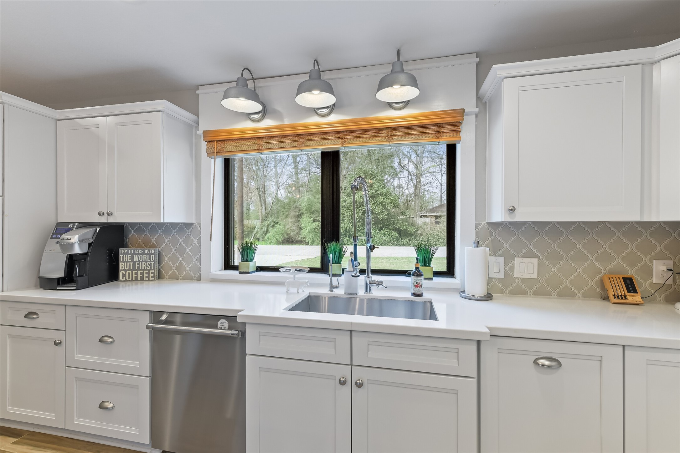 3319 Shadowcrest Lane Spring, TX 77380 - Photo 15 of 37 Experience modern convenience with a sleek undermount kitchen sink featuring a reverse osmosis system and a powerful 1 HP Insinkerator Evolution Excel disposer with a stainless-steel chamber. This stunning kitchen features a plumbed coffee machine that stays.