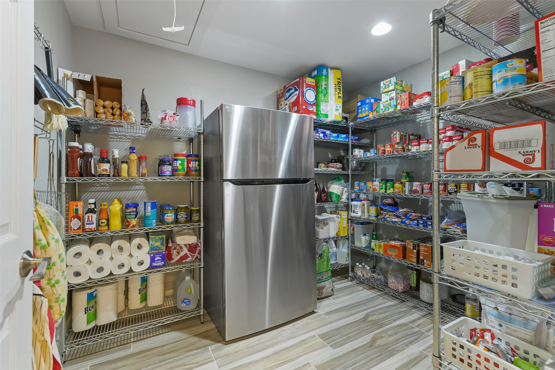 3319 Shadowcrest Lane Spring, TX 77380 - Photo 19 of 37 Expansive 8x10 walk-in pantry with ample storage and plumbed for a refrigerator.