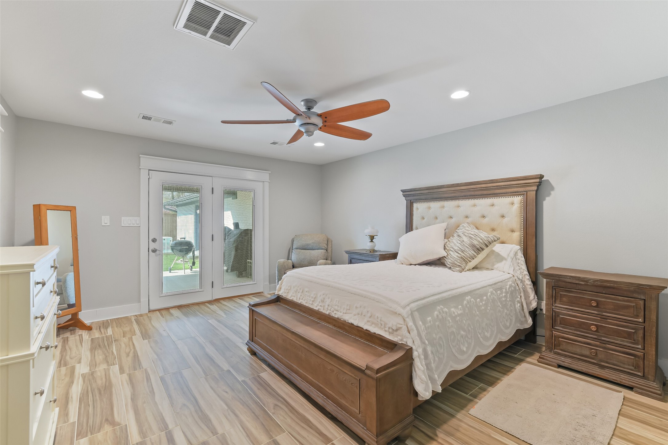 3319 Shadowcrest Lane Spring, TX 77380 - Photo 20 of 37 Serene primary bedroom featuring recessed lighting, a ceiling fan, and French doors leading to the patio.