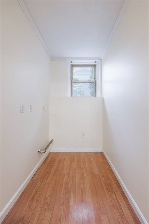 52 Garden Street, Unit B2 Cambridge, MA 02138 - Photo 7 of 17 a view of a room with wooden floor and white walls