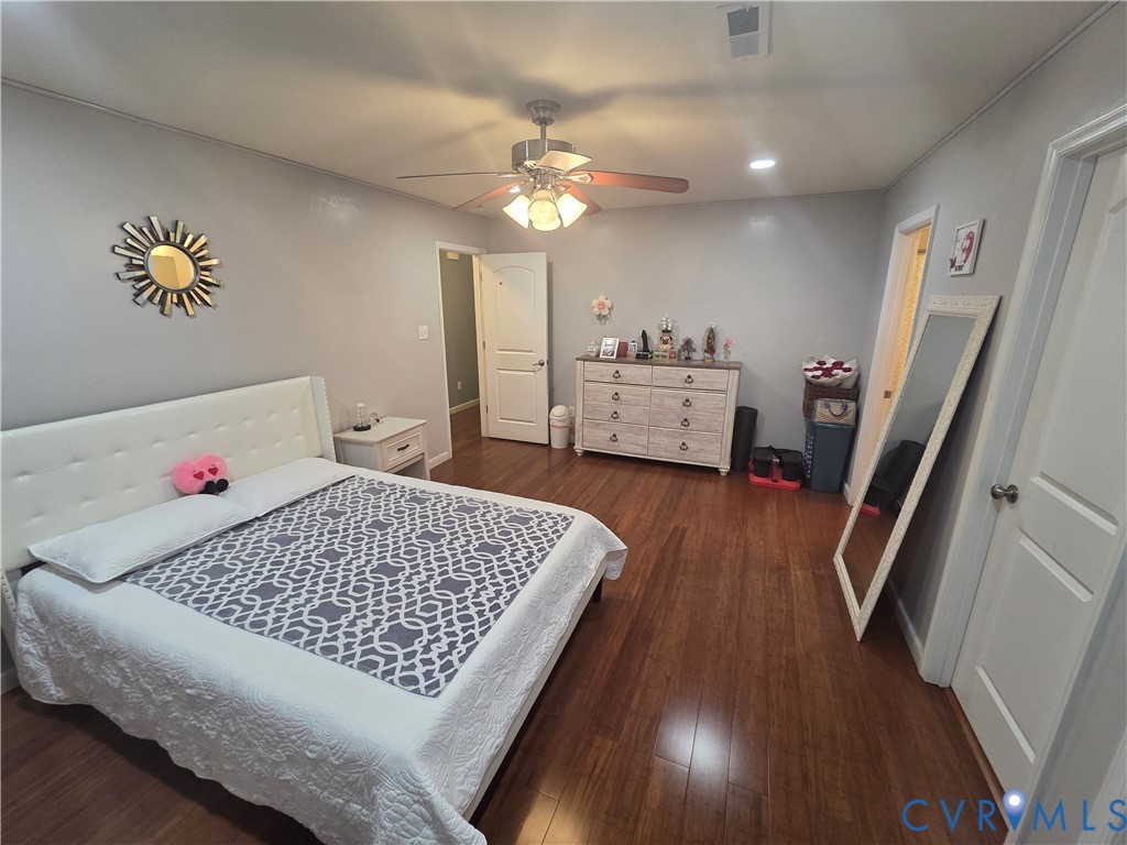 4504 Warwick Road Richmond, VA 23234 - Photo 13 of 15 a living room with furniture and a chandelier