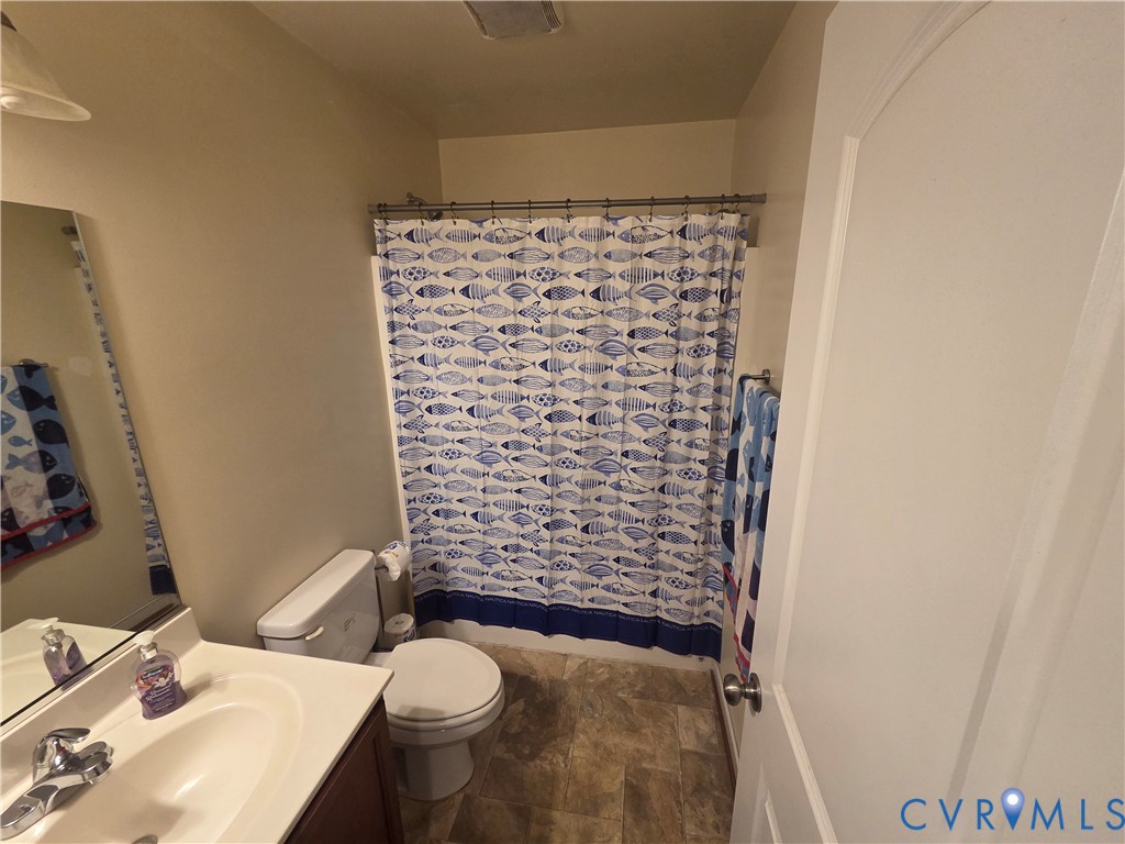 4504 Warwick Road Richmond, VA 23234 - Photo 9 of 15 a bathroom with a sink and a toilet
