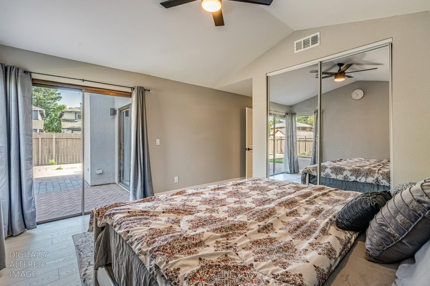 2 Rio Campo Court Sacramento, CA 95834 - Photo 14 of 24 a bedroom with a bed and a chandelier