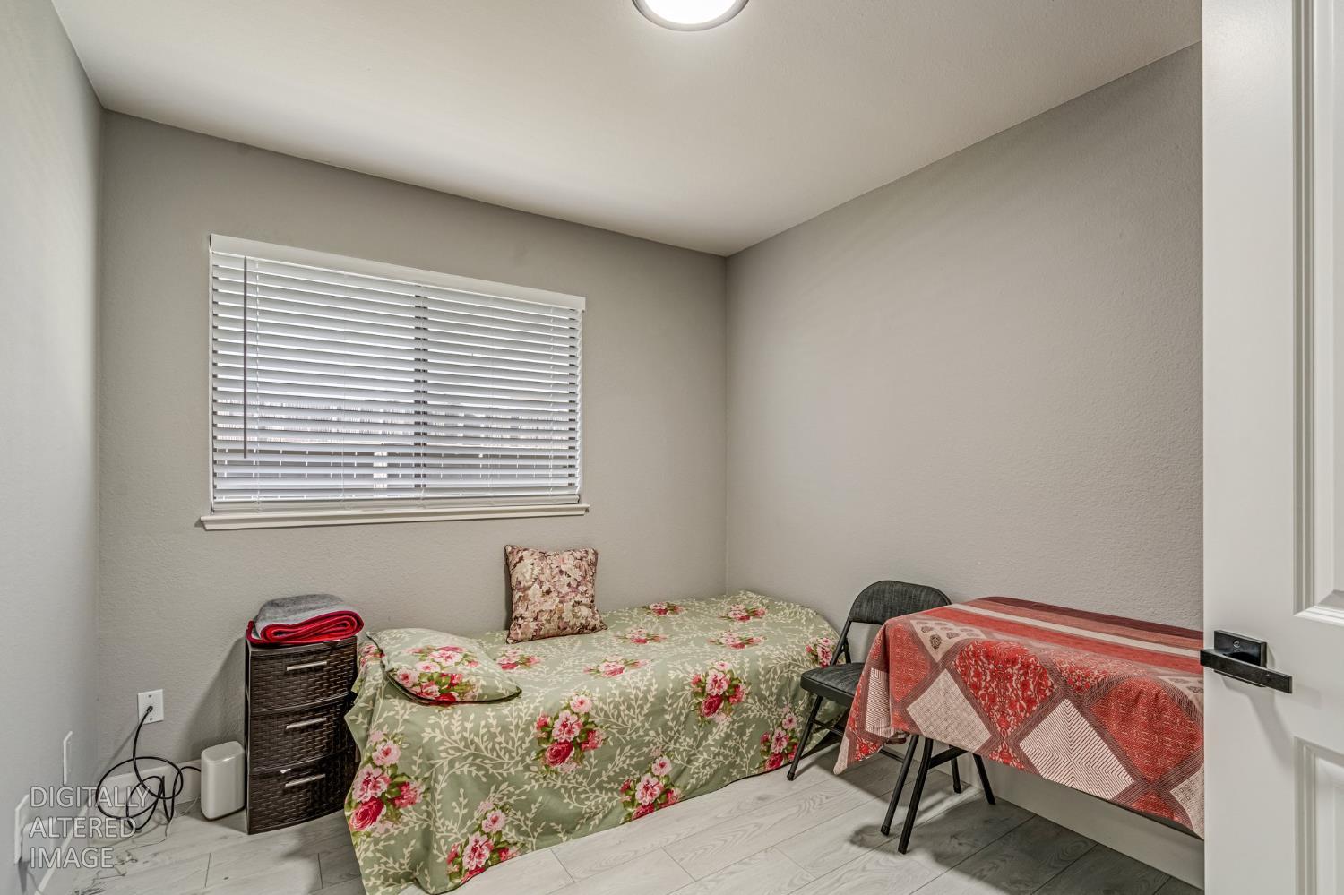 2 Rio Campo Court Sacramento, CA 95834 - Photo 17 of 24 a bedroom with a bed and a window