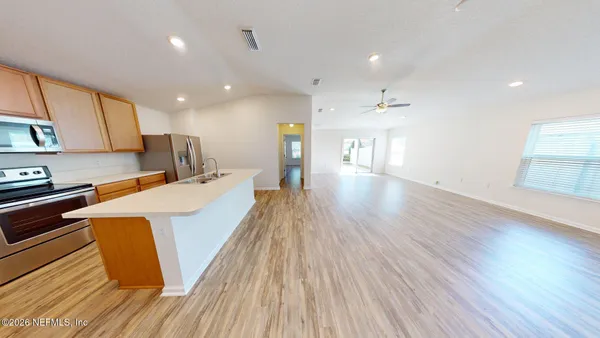 wooden floor in an empty room with a mirror