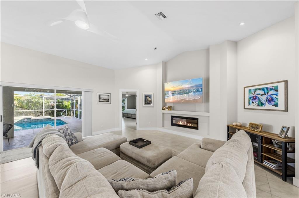 4724 Riverside Drive Estero, FL 33928 - Photo 5 of 44 a living room with furniture fireplace and window