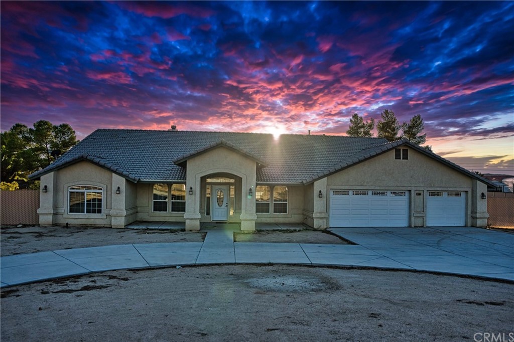 15380 Pohez Road Apple Valley, CA 92307 - Photo 1 of 1 a front view of a house with a yard