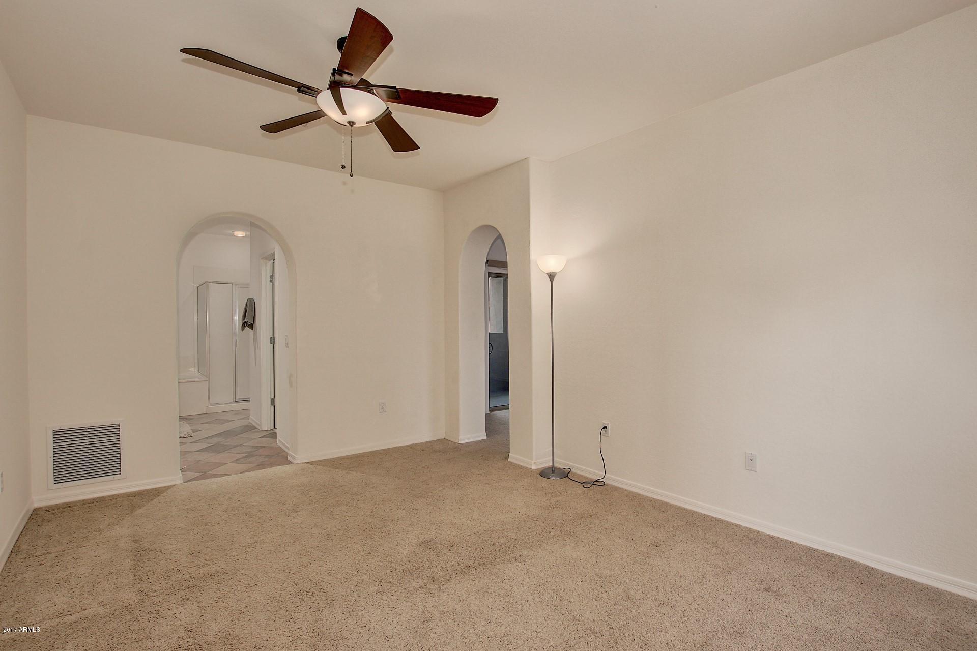 3935 East Rough Rider Road, Unit 1361 Phoenix, AZ 85050 - Photo 19 of 64 Master Bedroom