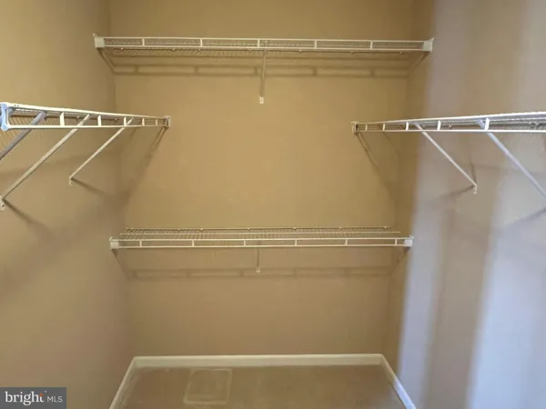 a view of a room with racks on the wall