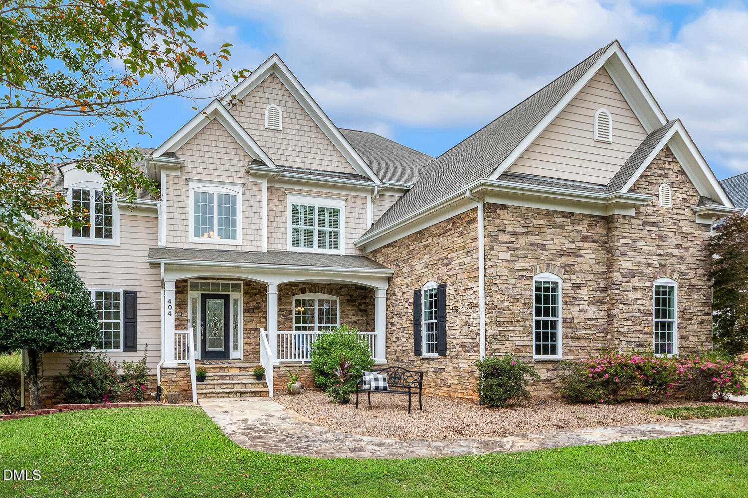 404 Vintage Hill Circle Apex, NC 27539 - Photo 1 of 82 a front view of a house with a yard and potted plants
