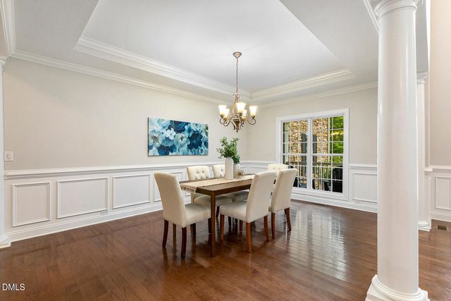 a kitchen with stainless steel appliances granite countertop a stove top oven a sink dishwasher and a refrigerator with the cabinets