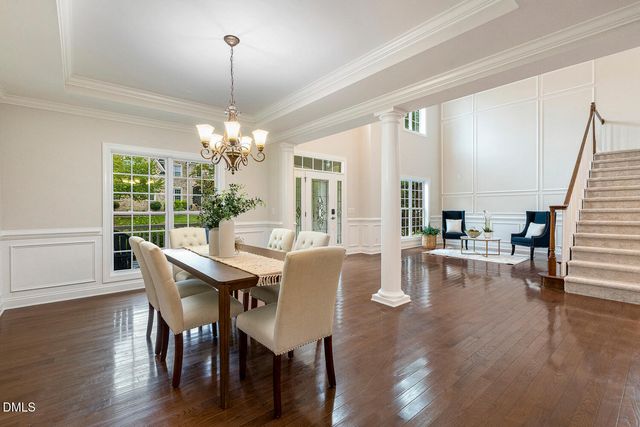 a kitchen with stainless steel appliances kitchen island granite countertop a stove microwave and cabinets